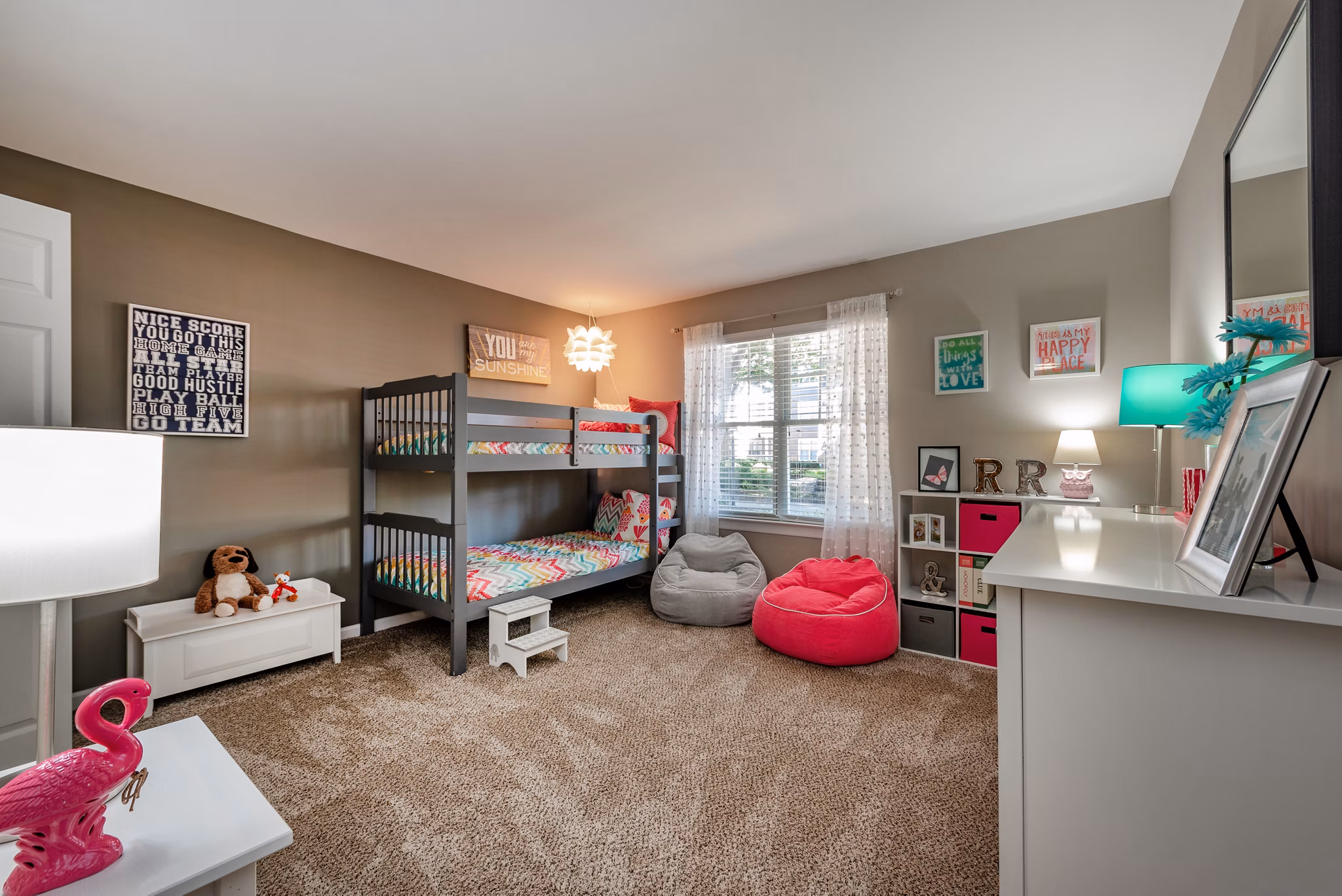 Cozy bedroom with modern furnishings at Avana Red Run Apartments