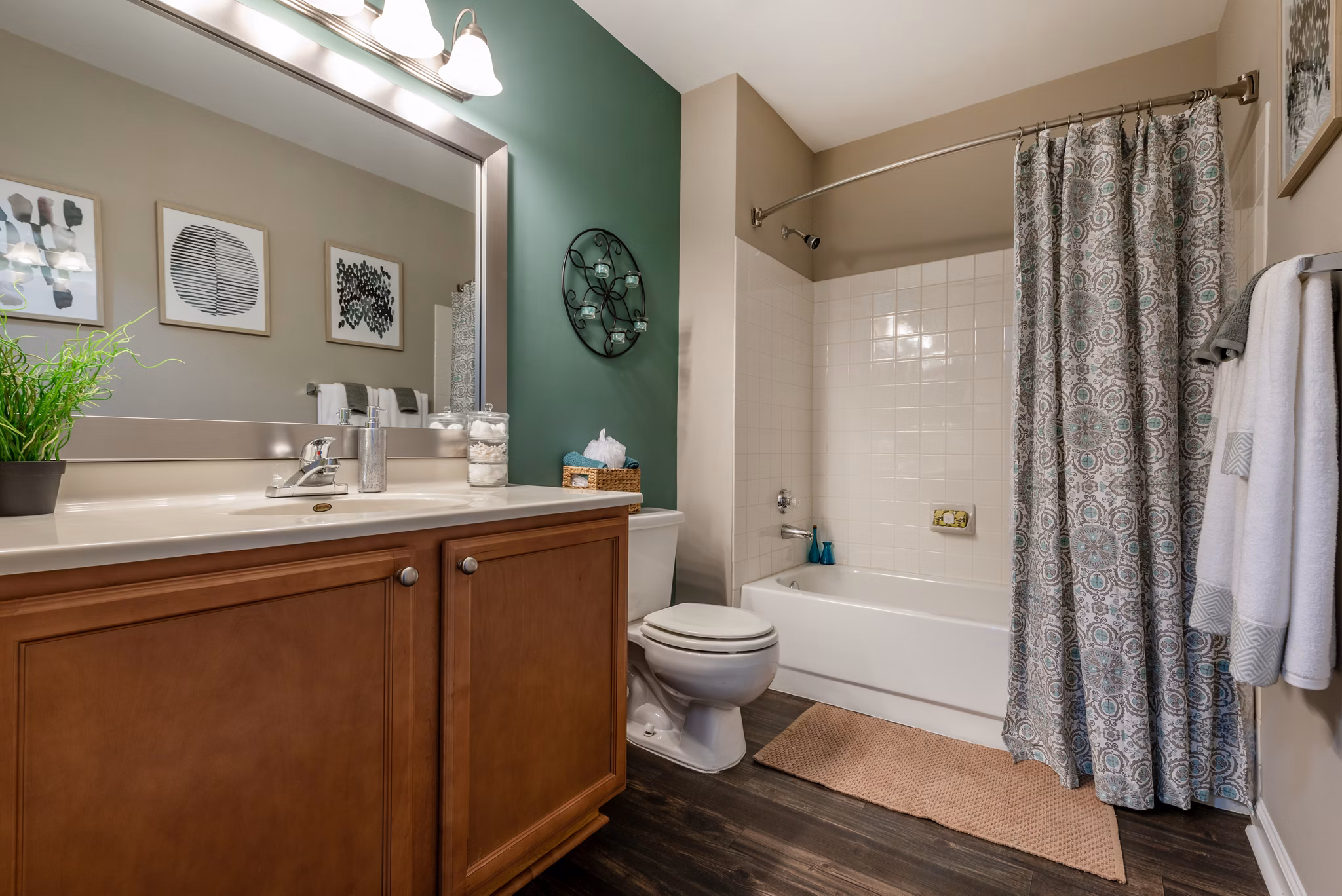 Elegant bathroom featuring modern fixtures and granite countertops at Avana Red Run Apartments