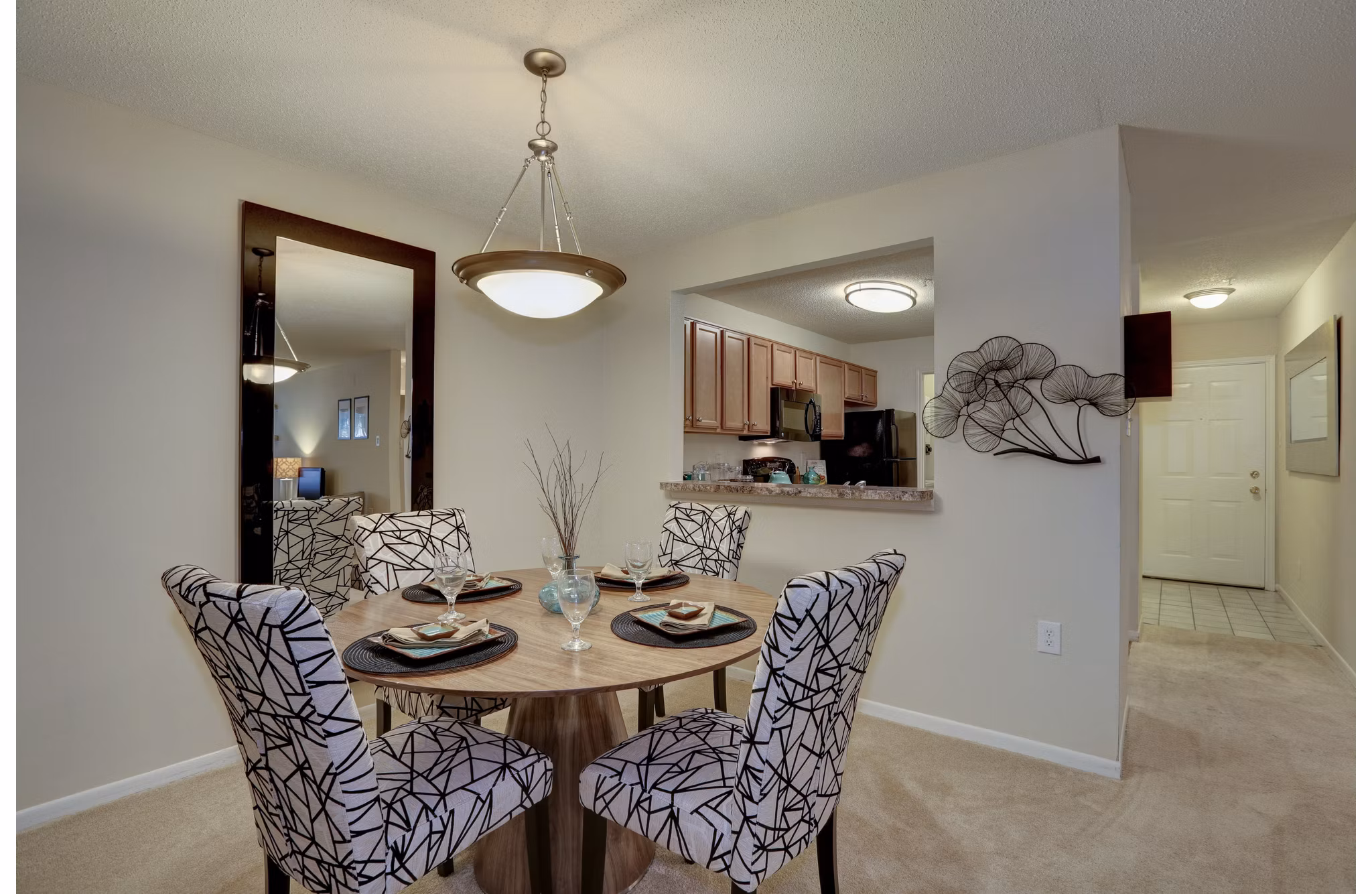 Dining area with modern decor and natural light at Avana Red Run Apartments