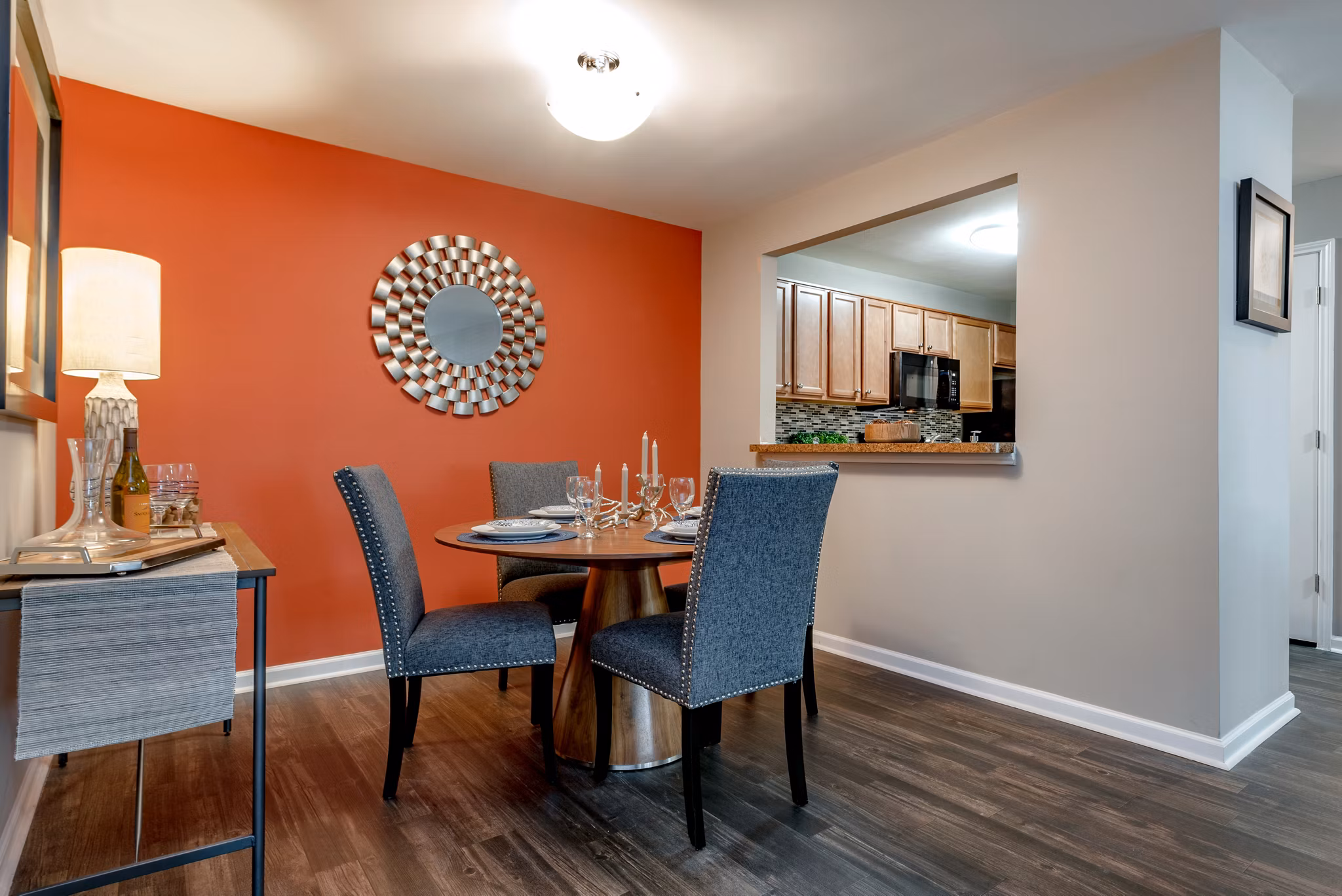 Dining area with modern furnishings and pendant lighting in Avana Red Run Apartments, a luxury living space