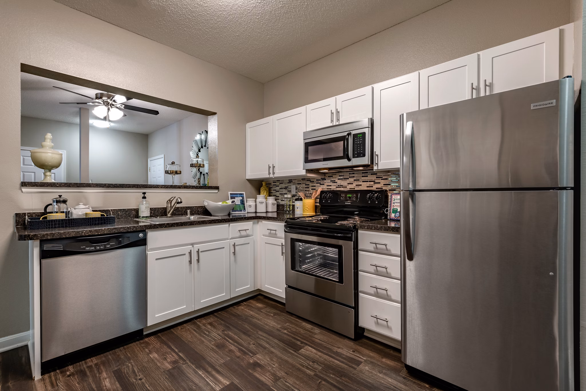 Modern kitchen with stainless steel appliances at Avana Red Run Apartments