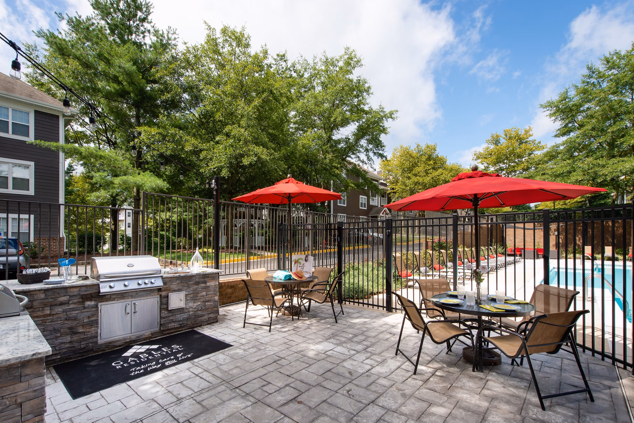 Outdoor grill area with modern appliances at Avana Red Run Apartments