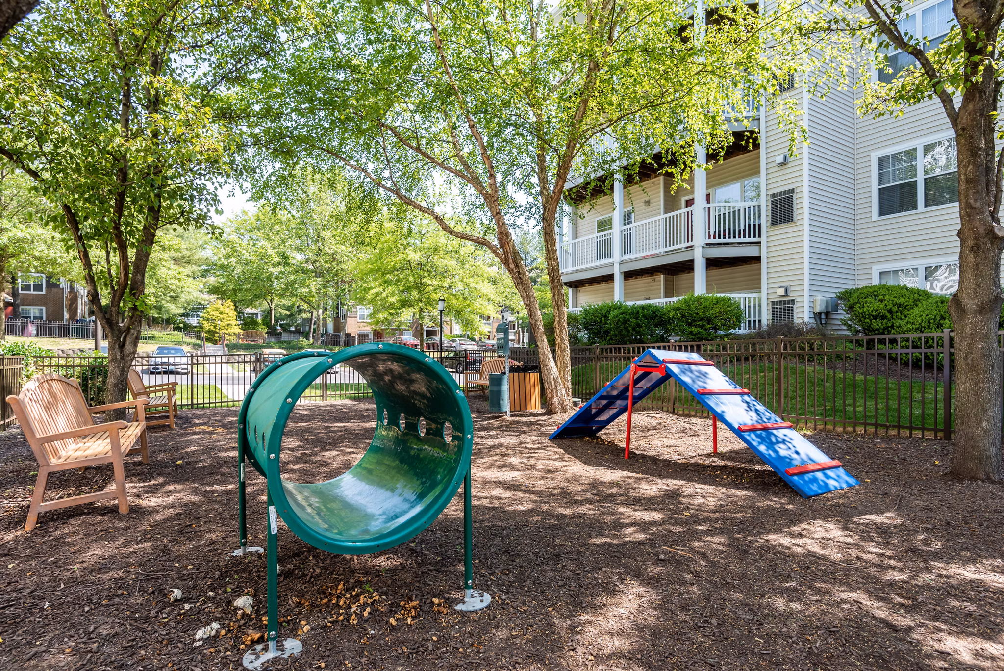 Dog-friendly park at Avana Red Run Apartments with agility equipment and open space for residents' pets to play and socialize