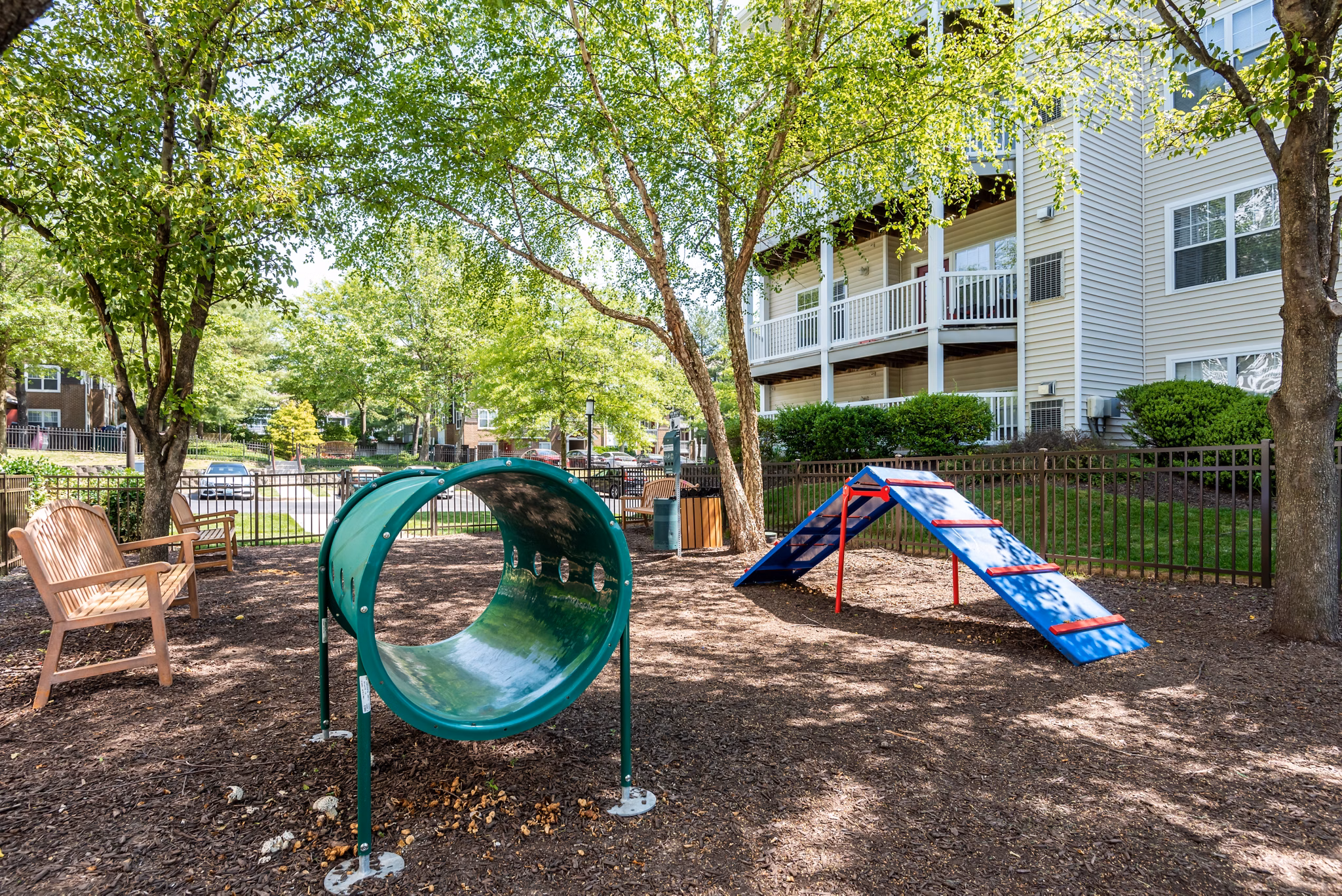 Dog-friendly park at Avana Red Run Apartments with agility equipment and open space for residents' pets to play and socialize