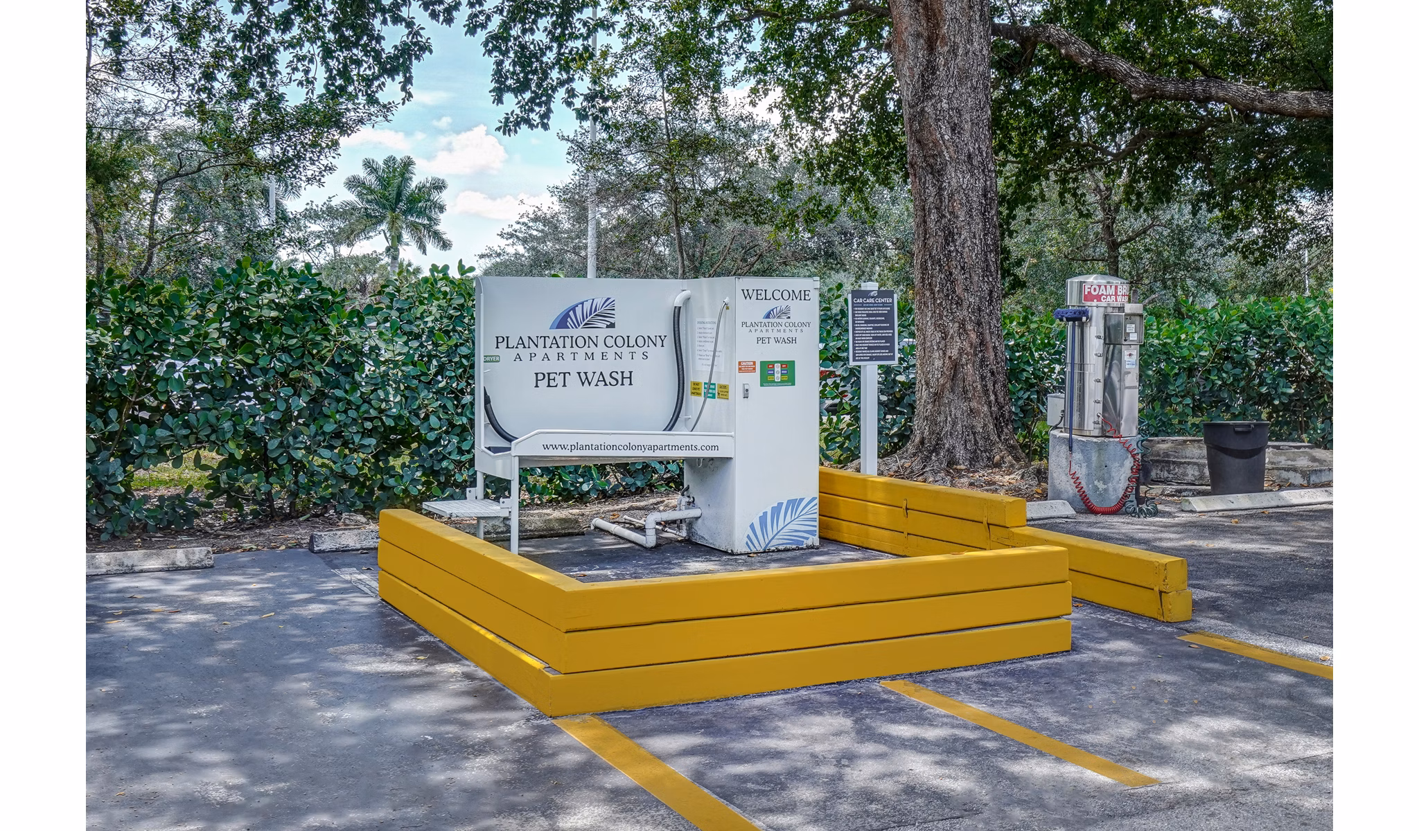 Outdoor pet wash station at Plantation Colony Apartments featuring modern amenities